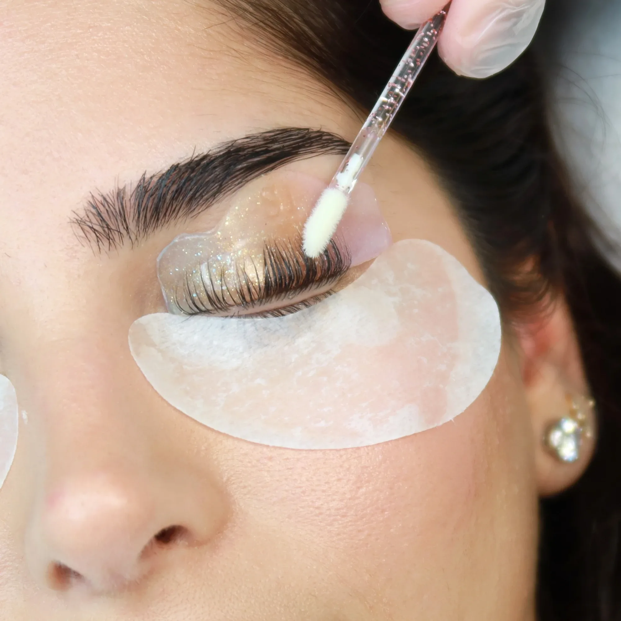 Lifting solution applied to shielded natural lashes at AZIZAM beauty salon, Dubai