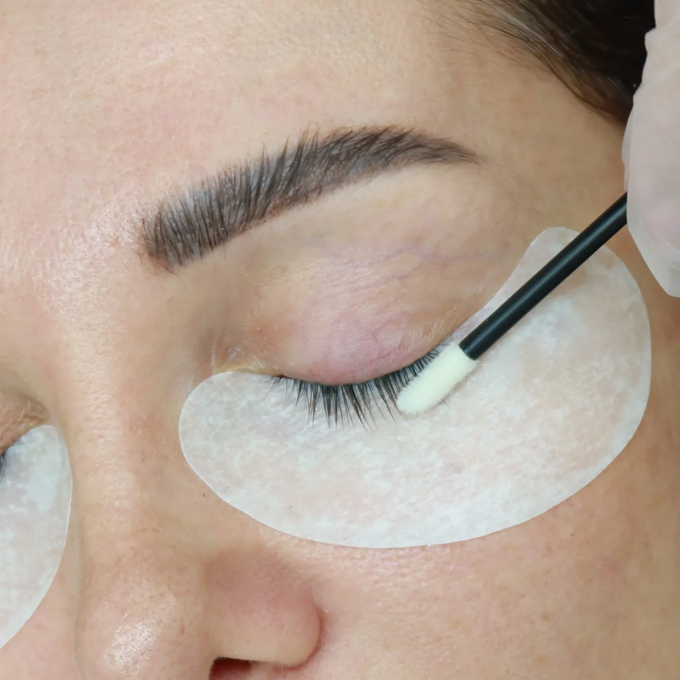 Classic lash extensions in Dubai, natural lashes primed and combed at AZIZAM beauty salon