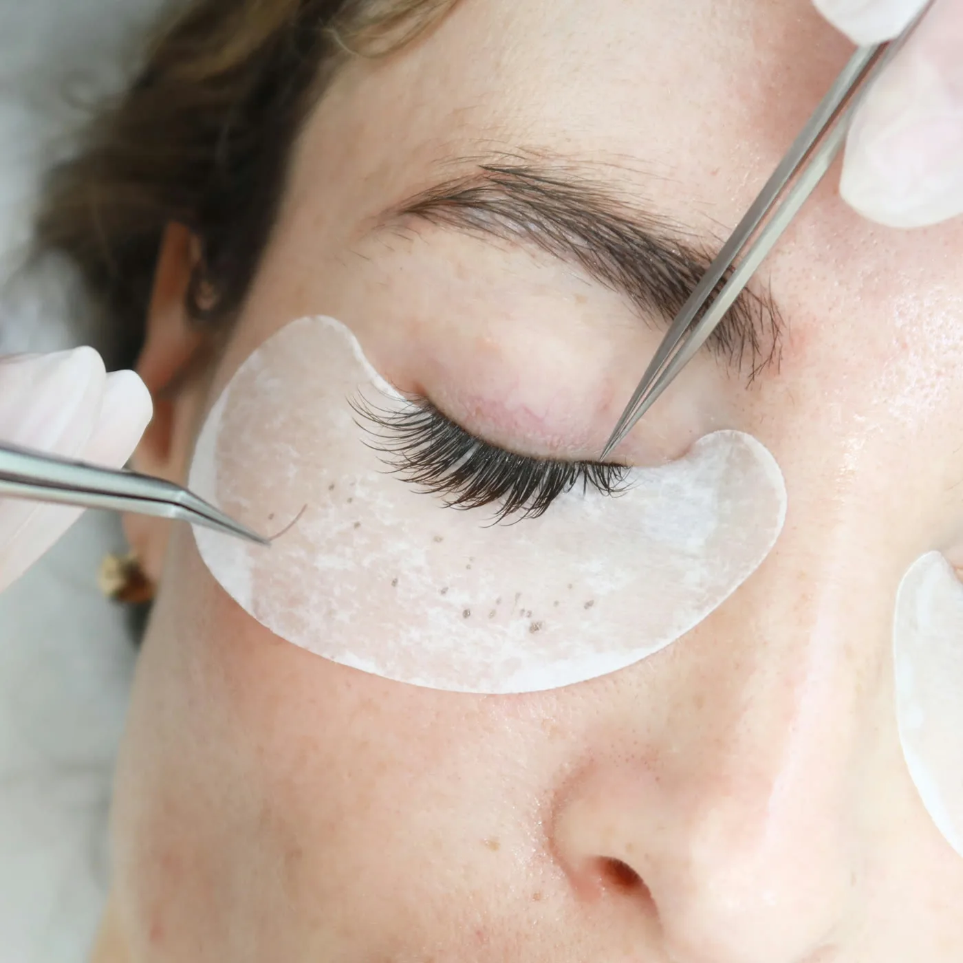 Silk lash extensions in Dubai — one fibre applied per natural lash at AZIZAM beauty salon